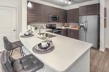 Modern Kitchen with Stand-Alone Breakfast Bar at Crabtree Lakeside in Raleigh, NC